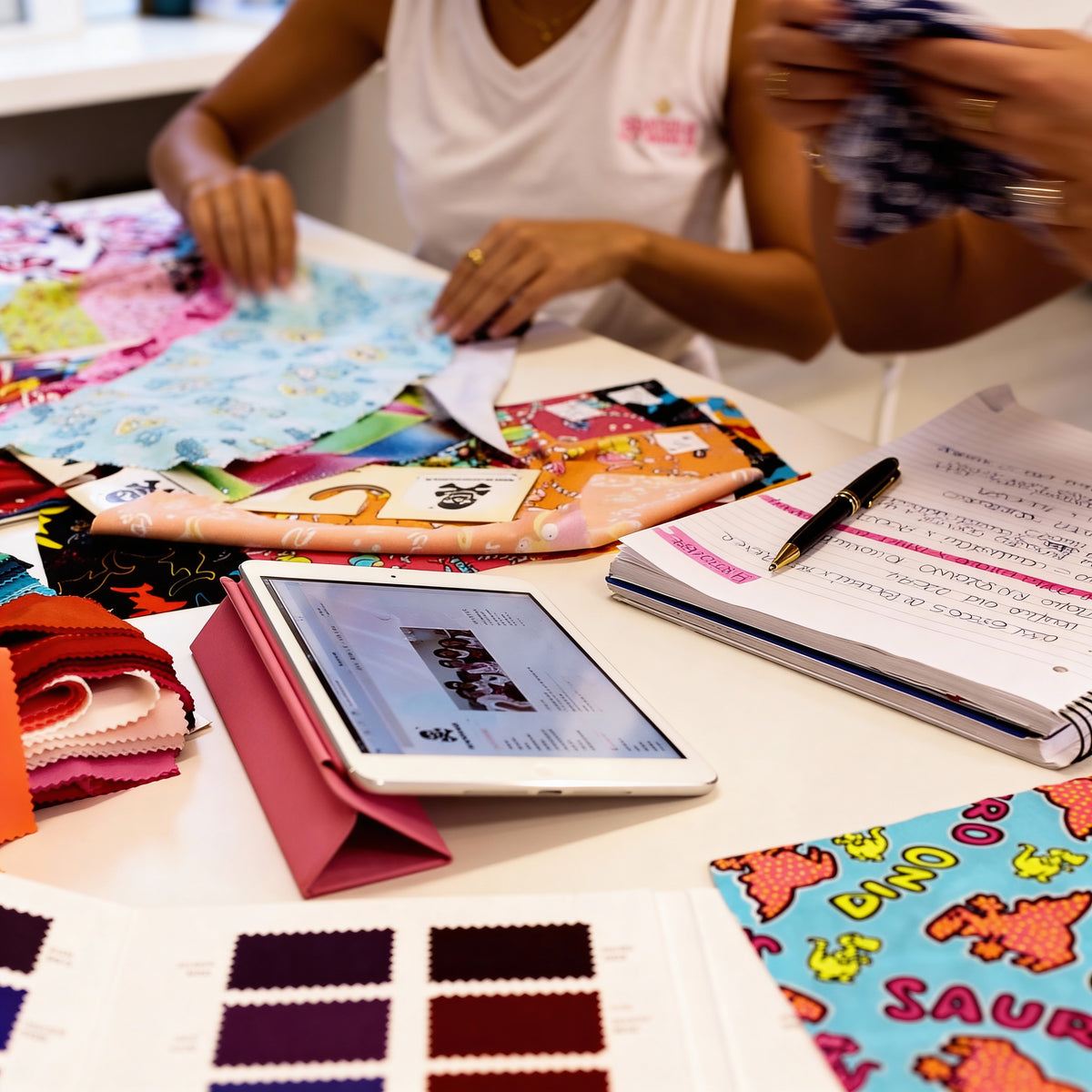 The worktable in the BONESWIMMER atelier in Gallarate: prints, samples, colour cards